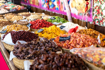 Raisins, dates and other candied fruits, sugar coated, for sale in a market.