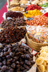Raisins, dates and other candied fruits, sugar coated, for sale in a market.