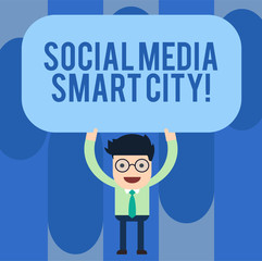 Writing note showing Social Media Smart City. Business photo showcasing Connected technological advanced modern cities Man Standing Holding Above his Head Blank Rectangular Colored Board