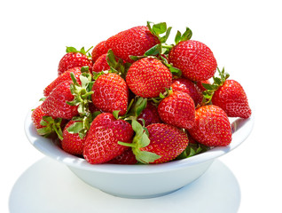 white ceramic bowl with strawberries isolated on white background