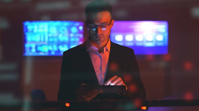 The businessman working with a tablet in the modern room