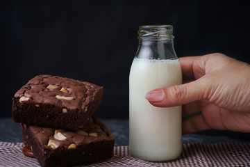 Brownies with bottle of milk