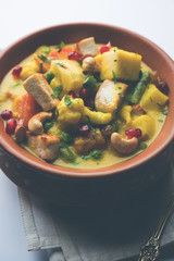 Navratan Korma is a rich, creamy and flavorful Mughlai dish  from India that literally translates to nine-gem curry. The “gems” are the fruits, vegetables and nuts that make up the curry. 