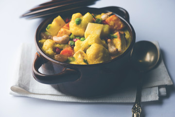 Navratan Korma is a rich, creamy and flavorful Mughlai dish  from India that literally translates to nine-gem curry. The “gems” are the fruits, vegetables and nuts that make up the curry. 