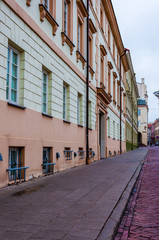 Fototapeta na wymiar Stylish and cozy Universiteto street in Old Town of Vilnius. Classical European architecture street design