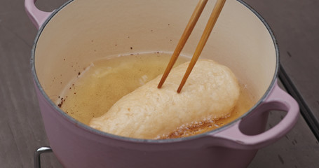 Cook prawn cracker in oil