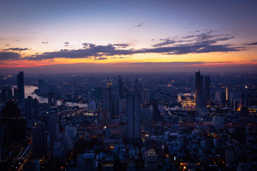 Beautiful twilight and cityscape on highest rooftop building at Bangkok in Thailand.