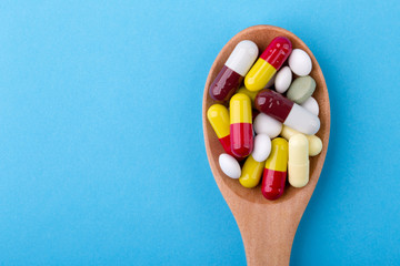 Medicine Pills Tablets And Capsules On Wooden Spoon