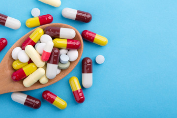 Medicine Pills Tablets And Capsules On Wooden Spoon