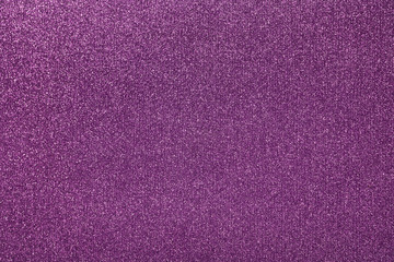 Abstract purple glitter texture background. Glowing shiny paper for warp your gift box or party decoration.