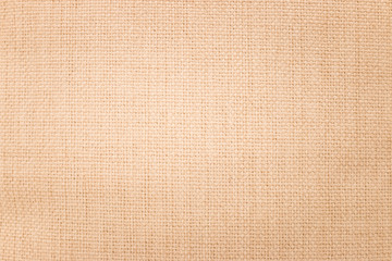 Brown burlap texture background. Weave textile material or blank cloth.