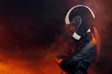 Biker Woman with Helmet and Leather Outfit Portrait