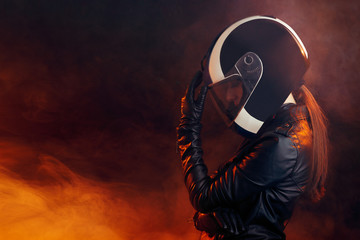 Biker Woman with Helmet and Leather Outfit Portrait - obrazy, fototapety, plakaty