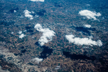 Mountain aerial view. houses and fields. clouds © joi