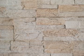 Texture of brown stone - granite tile on wall