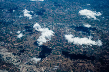 Mountain aerial view. houses and fields. clouds © joi