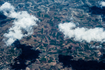 Mountain aerial view. houses and fields. clouds © joi