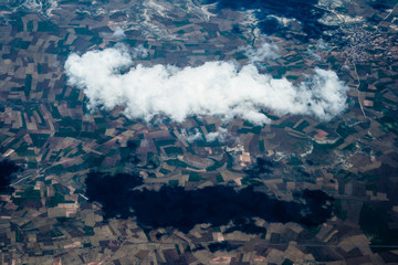 Mountain aerial view. houses and fields. clouds © joi