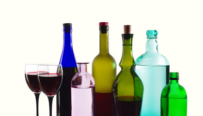 Bottles of wine and a glasses of wine. Isolated on a white background
