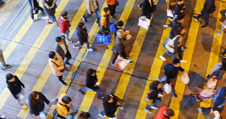 xTop view of people walking the street