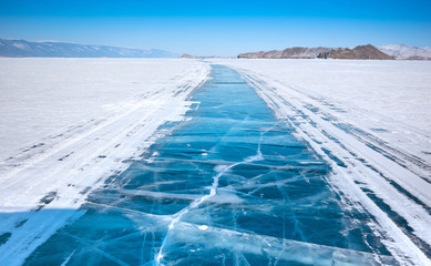 Smooth surface of frozen ice field of lake Baikal in winter