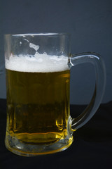 a mug of amber beer on the table