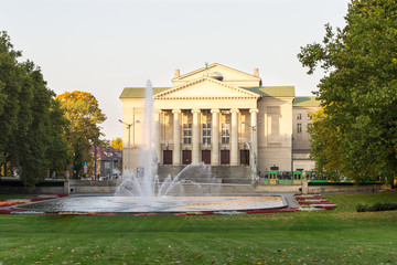 Obraz premium Poznan, Poland - October 12, 2018: Park with fountain before Opera House in polish city Poznan