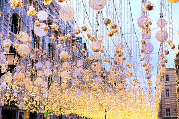 Christmas bright garlands on a city street