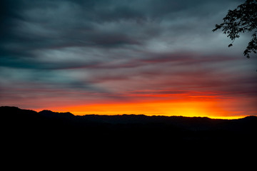 Fototapeta na wymiar sunrise on dark sky background.