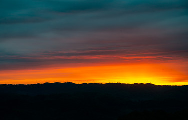 sunrise on dark sky background.