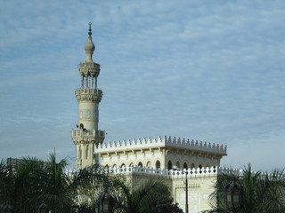 Fototapeta na wymiar Tower of Cairo with a minaret of the Mosque Madrassa of Sultan Hassan in Egypt
