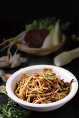 Sauteed yellow beef in a white dish