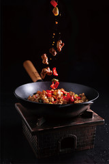 Sauteed beef steak in a iron pot