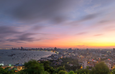 Fototapeta na wymiar Pattaya City and Sea with suset, Thailand. Pattaya city skyline and pier at sunset in Pattaya Chonburi Thailand