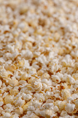 Salted popcorn closeup. Popcorn background. Snacks and food for the movie.