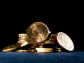 Gold coins over dark background