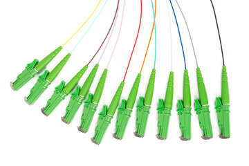 single mode fan out patch cord jumper with green fiber optic connector isolated on white background