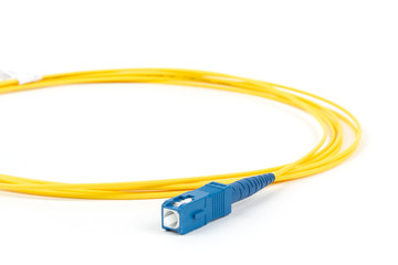 fiber optic single mode small form factor SC patch cord jumper with blue connector isolated on...