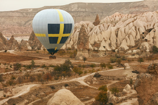 Travel. Hot Air Balloon Flying Above Rock Valley, Ballooning