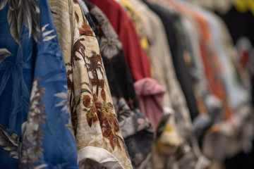 Fototapeta na wymiar Batik shirts on rack in store