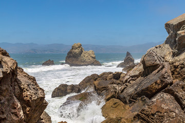 Fototapeta na wymiar Rock formations in the Pacific ocean near Ocean Beach, off the coast of San Francisco