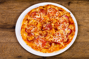 Pepperoni pizza with sausages
