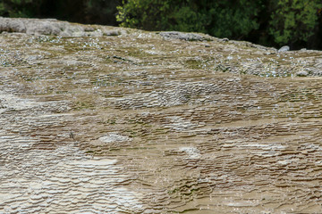 Sediment terraces forming in thermal landscape