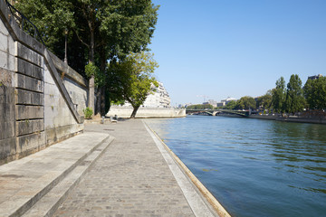 Paris, Seine river and empty docks, clear blue sky in France