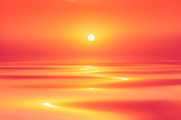 Tranquil seas beneath a vibrant, fiery sunset sky