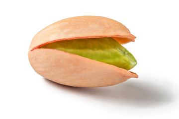 Single Turkish red pistachio, peeled green nut visible, isolated on white background.