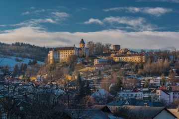 Castle and town Vimperk in cold sunny evening