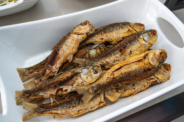 Indonesian food ikan goreng or fried fish in restaurant