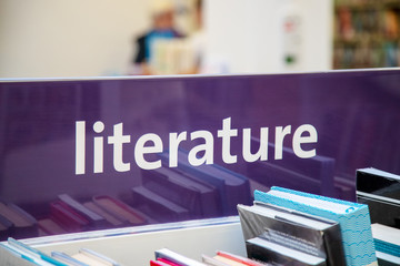 Library books and literature sign