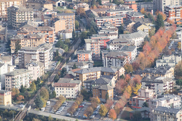 Fototapeta na wymiar Green city full of trees during autumn